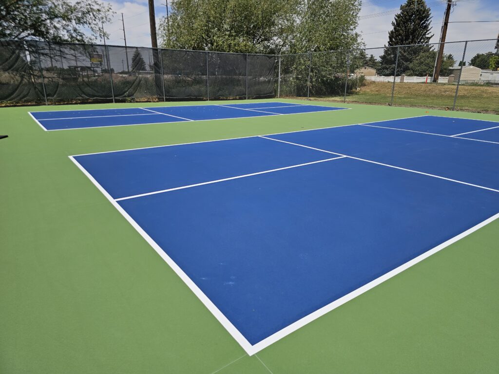 Converted tennis courts to pickleball courts, installed net posts and nets and installed the acrylic surfacing with lines.