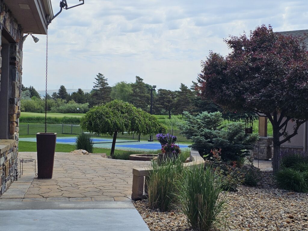 Beautiful backyard oasis with a pickleball court.